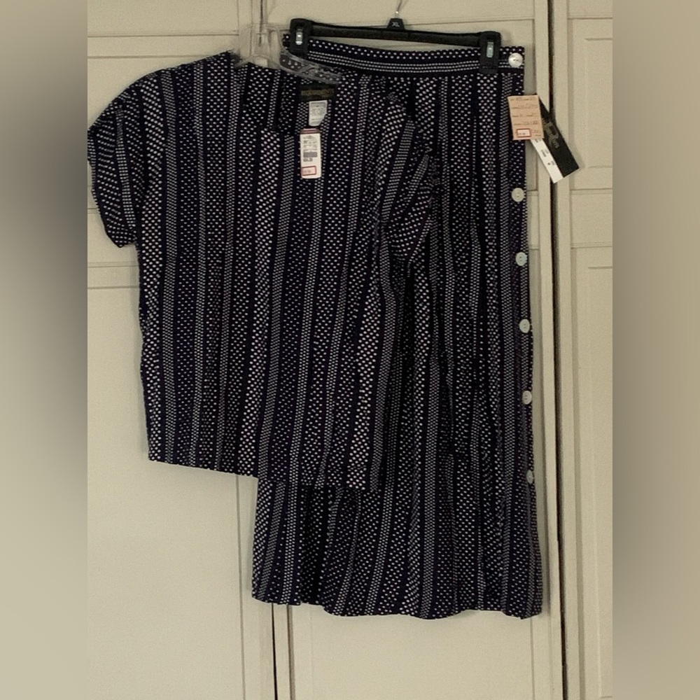 2 piece Requirements ensemble. Light weight top and skirt.